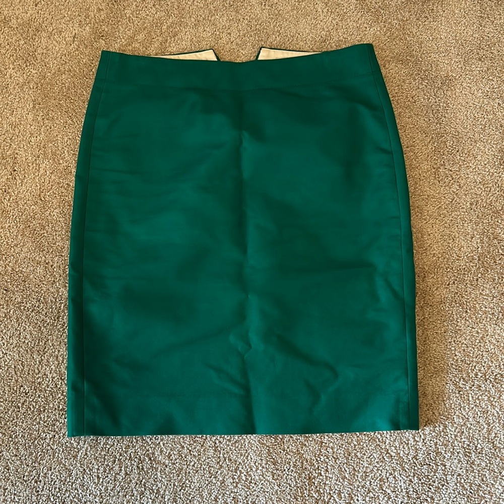 J. Crew brand, fancy green mini/pencil skirt (fake pockets).